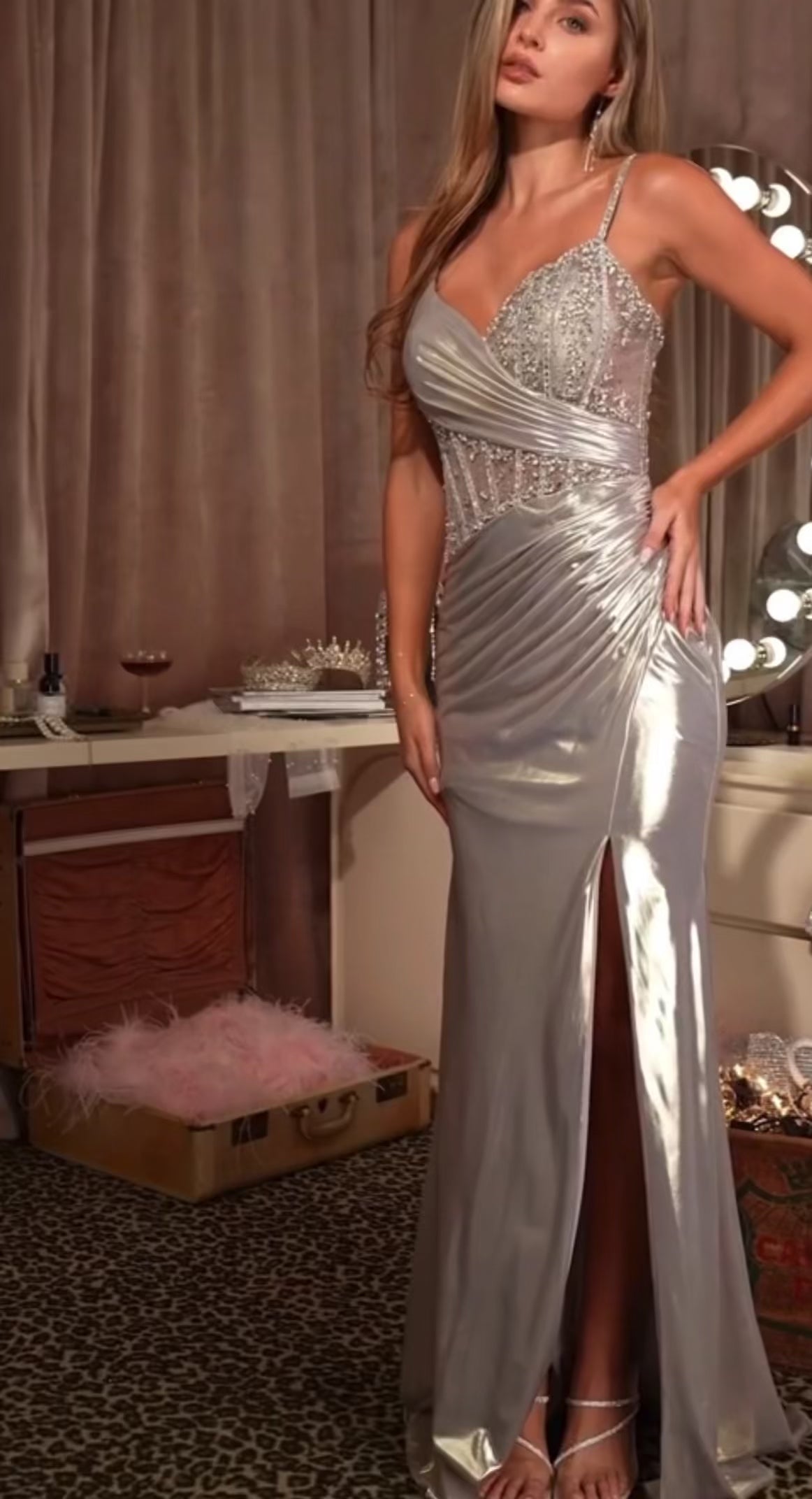 Sweetheart neckline with pleated bodice and beaded sheer corset gown